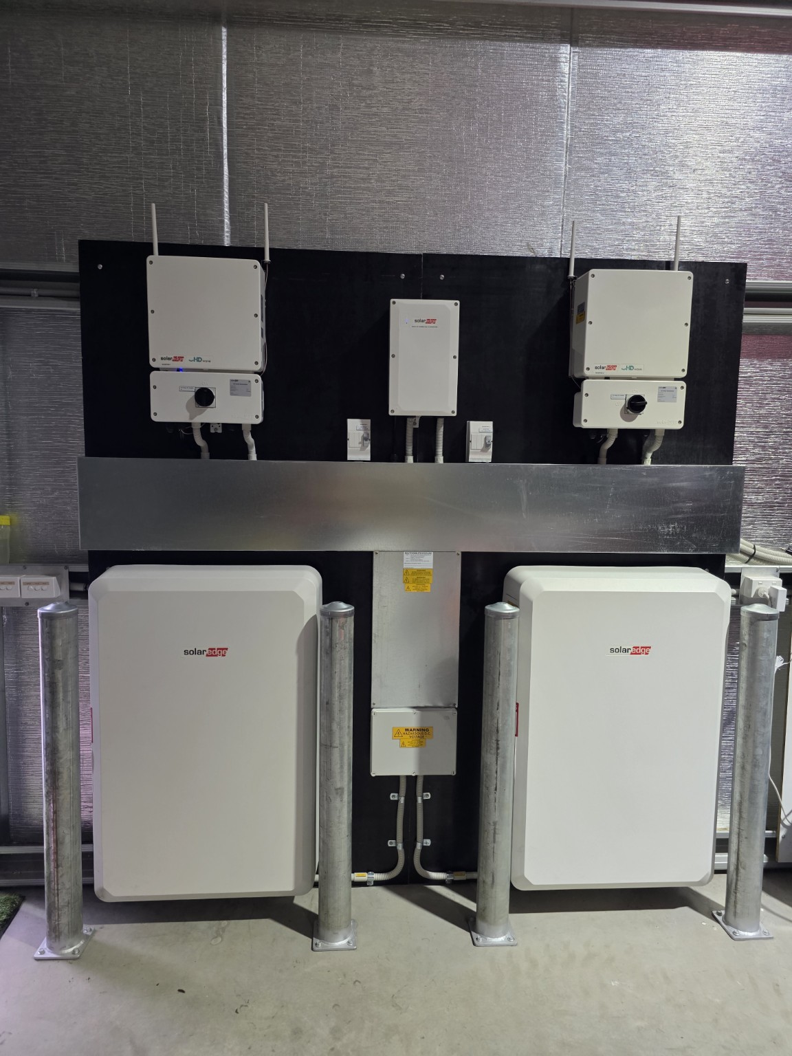 Residential SolarEdge system with two inverters and two batteries