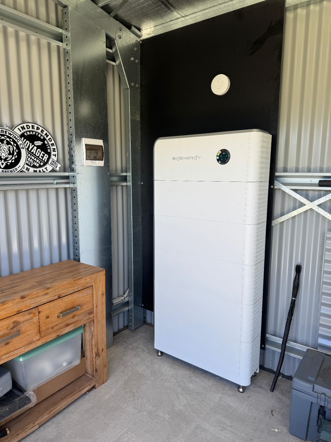 Sigenergy battery system installed neatly inside a shed